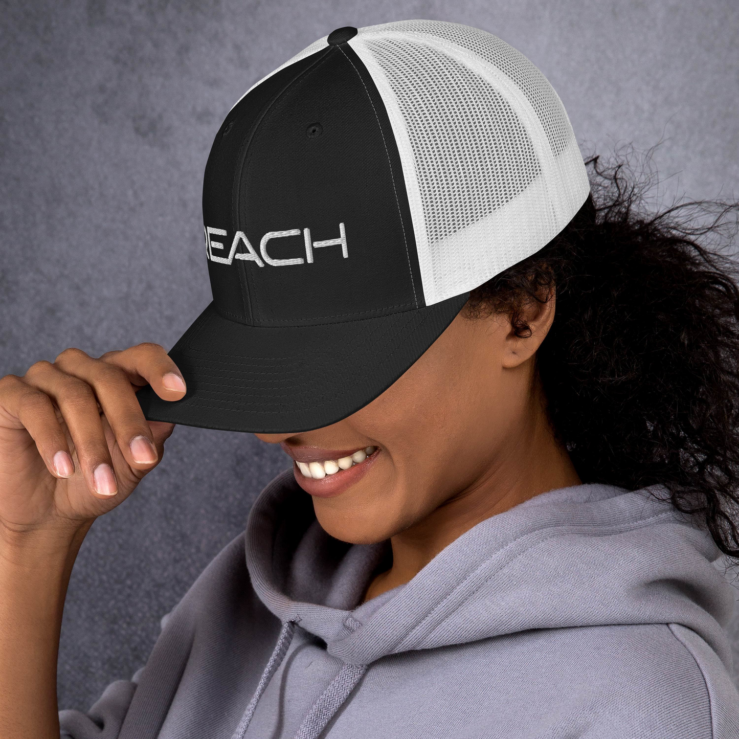 REACH Snapback Trucker Cap